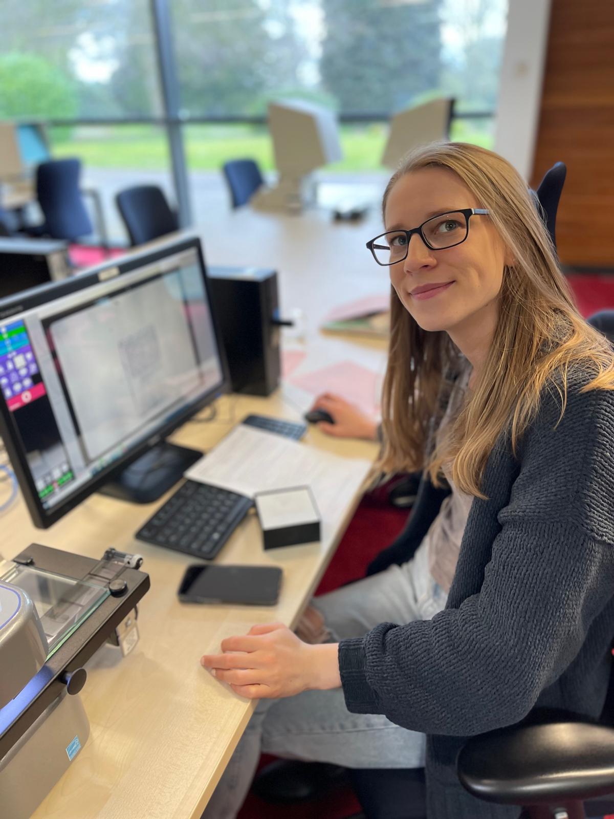Brittany researching in an archive